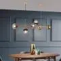 LITFAD Globe Shaped Island Lamp Smoke Gray Glass 6 Lights Dining Room Pendant Lighting Fixture Modern LED Chandelier in Brass Metal with Adjustable Cord for Bedroom Restaurant Hotel Bar