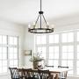 Merbotin Industrial Round Chandelier, 6-Light Wagon Wheel Chandeliers Rustic Ceiling Light Pendant Light for Kitchen Island Dining Room Foryer, Matte Black & Antique Brass Accents, 26'' Diameter