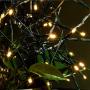 Funiao 105ft 300 LED Christmas Lights Outdoor Indoor Extendable Green Wire Fairy String Lights 8 Modes Waterproof Decorative Twinkle Lights for Xmas Tree Holiday Party Decoration (Warm White)