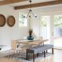 Kira Home Jericho 25'' 6-Light Large Rustic Farmhouse Wagon Wheel Chandelier, Round Kitchen Island Light, Textured Black Accents + White Ash Wood Style Finish